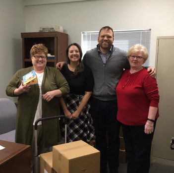 Dr. Stephanie donating Let's Learn About Chemistry books to the Indiana Head Start Association